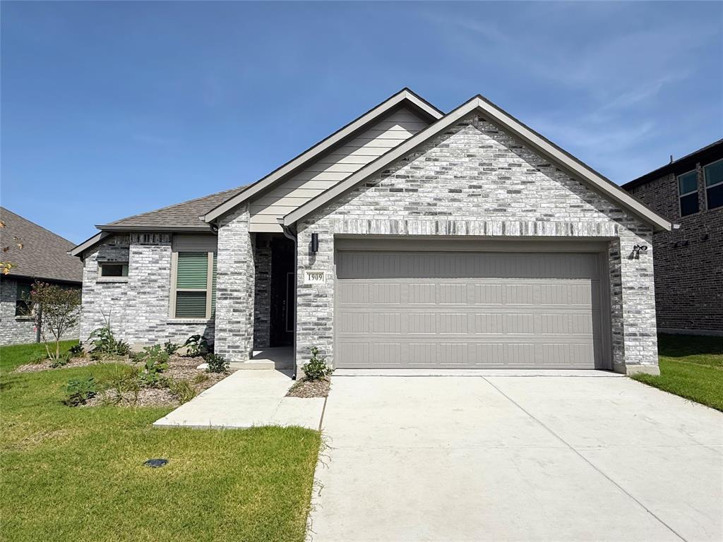 1909 Sandpiper Way Princeton, TX 75407 - Photo 1 of 35 View of front facade featuring driveway, a front lawn, a garage, brick siding, and a shingled roof