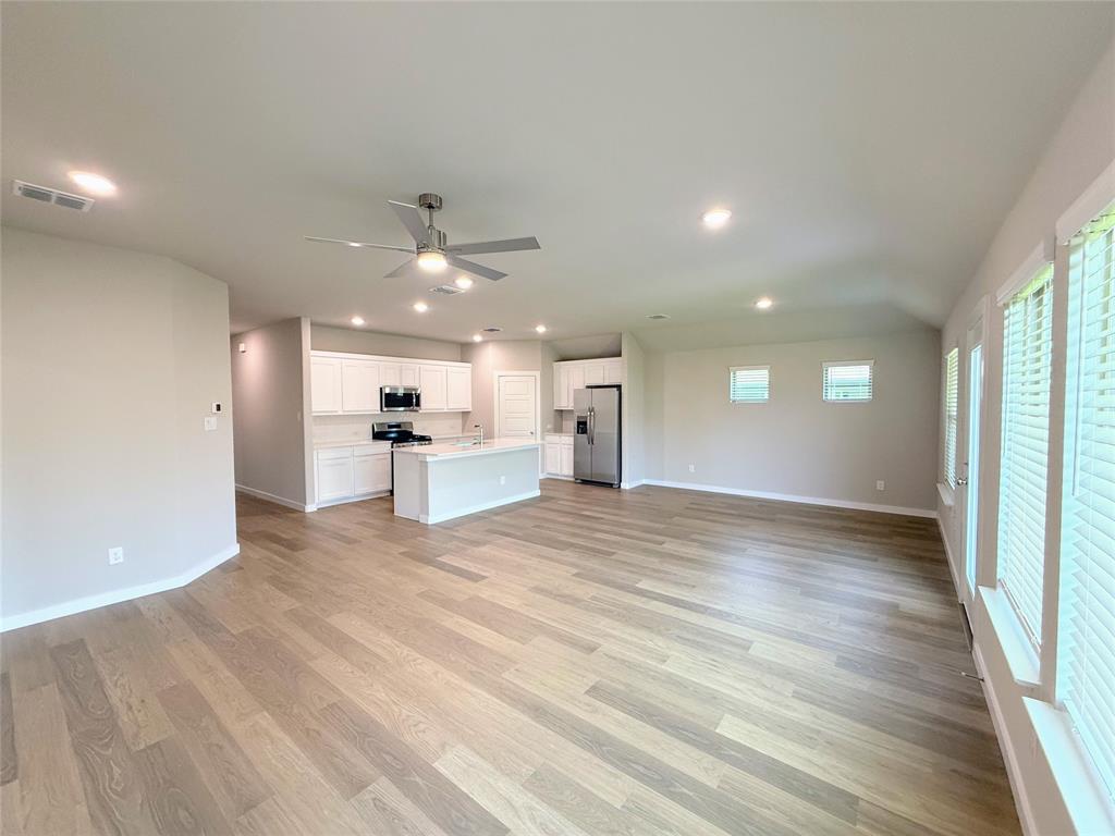 1909 Sandpiper Way Princeton, TX 75407 - Photo 9 of 35 Unfurnished living room featuring recessed lighting, light wood-style floors, and ceiling fan