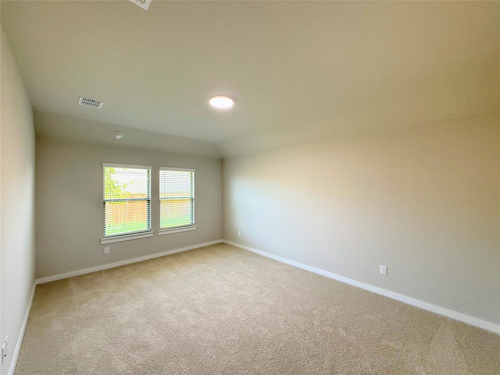 1909 Sandpiper Way Princeton, TX 75407 - Photo 10 of 35 Spare room with light colored carpet and baseboards