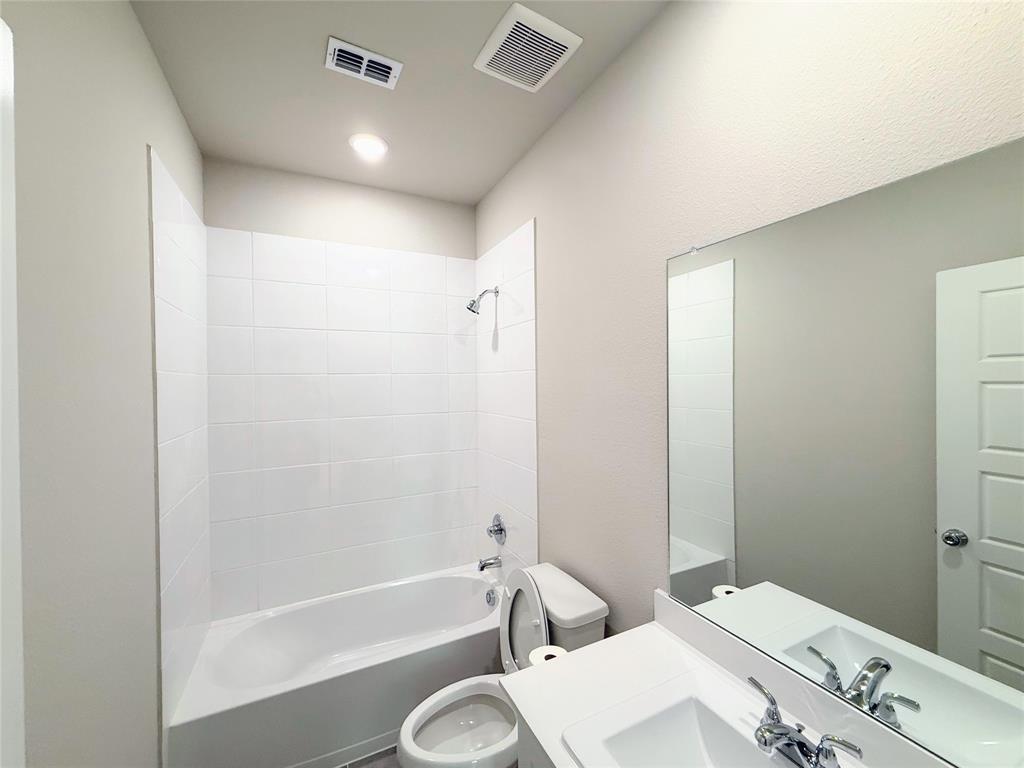 1909 Sandpiper Way Princeton, TX 75407 - Photo 16 of 35 Bathroom with shower / washtub combination and vanity