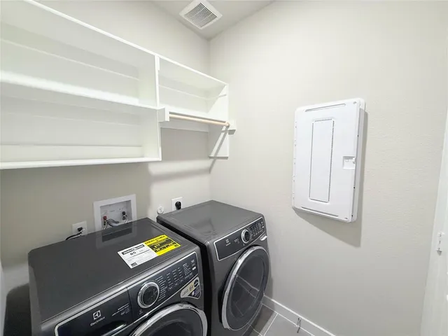 an empty room with wooden floor and closet