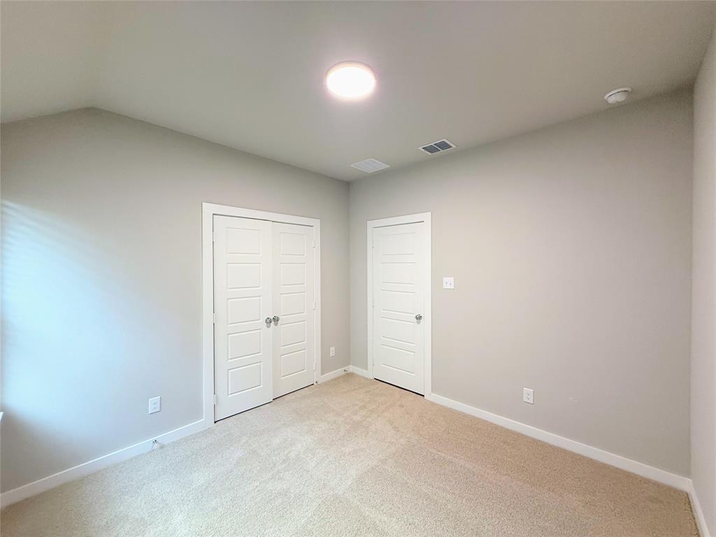 1909 Sandpiper Way Princeton, TX 75407 - Photo 24 of 35 Unfurnished bedroom with carpet and a closet