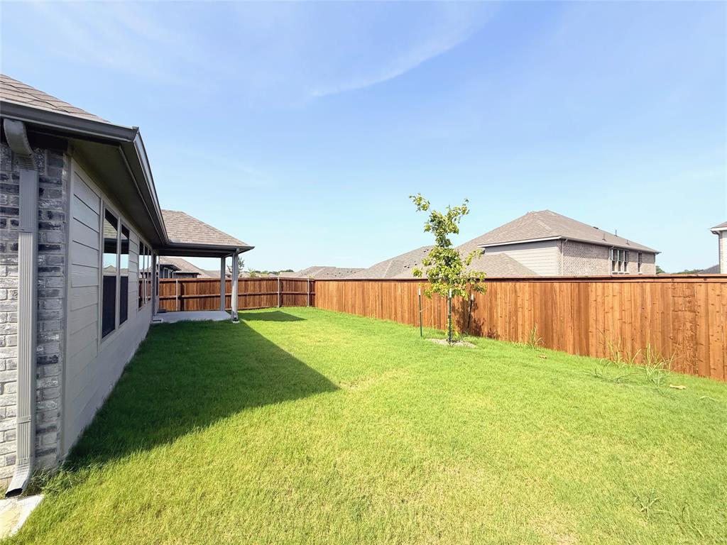 1909 Sandpiper Way Princeton, TX 75407 - Photo 26 of 35 View of fenced backyard