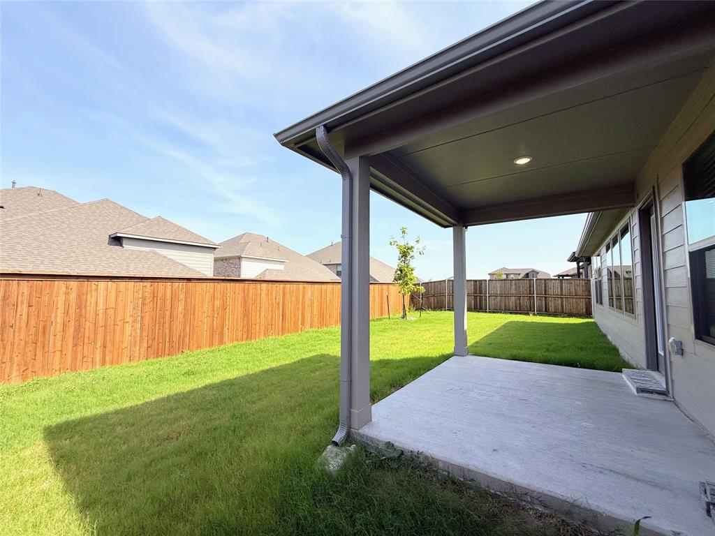 1909 Sandpiper Way Princeton, TX 75407 - Photo 28 of 35 Fenced backyard featuring a patio area