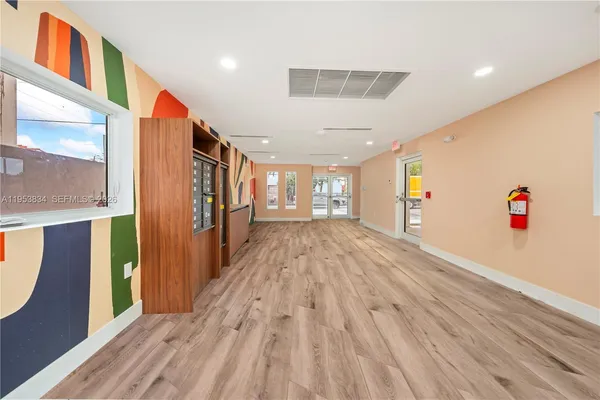 a view of entryway with wooden floor