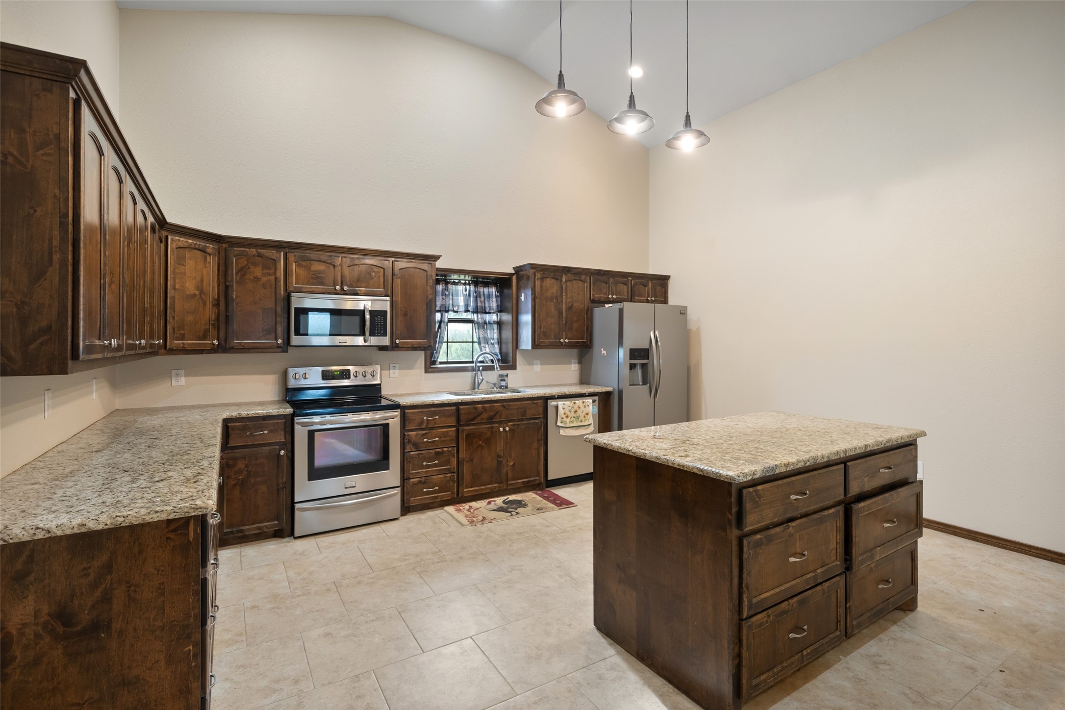 119 Fm 1891 Shiner, TX 77984 - Photo 25 of 40 a kitchen with a stove a sink and a refrigerator