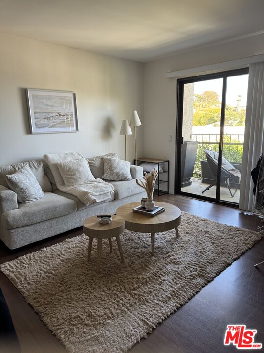 a living room with furniture and a rug