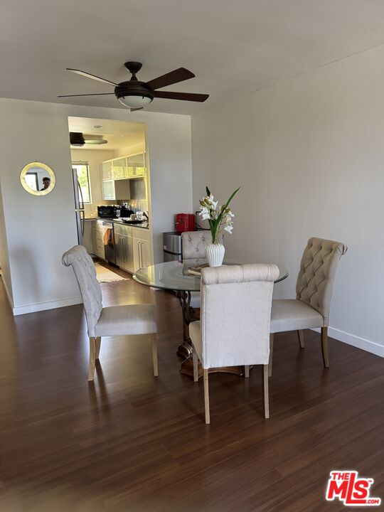 6465 Kanan Dume Road Malibu, CA 90265 - Photo 2 of 14 a view of a dining room with furniture and wooden floor