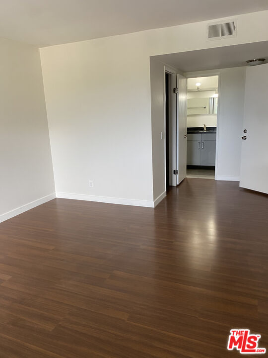 6465 Kanan Dume Road Malibu, CA 90265 - Photo 10 of 14 a view of room with window and wooden floor