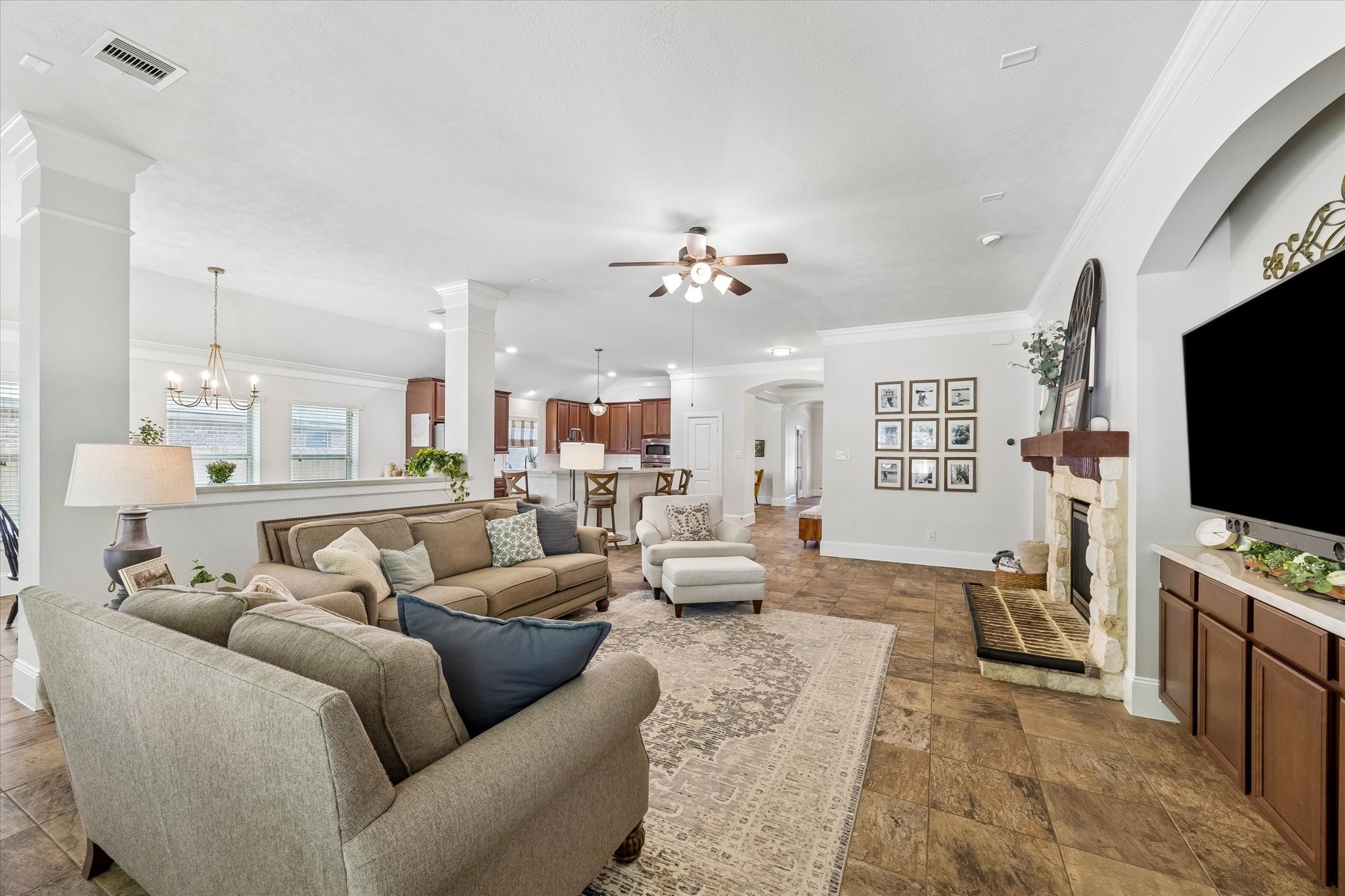 31306 Brighton Brook Lane Spring, TX 77386 - Photo 11 of 34 Inviting living area with high ceilings, abundant natural light, and open sightlines throughout the home.