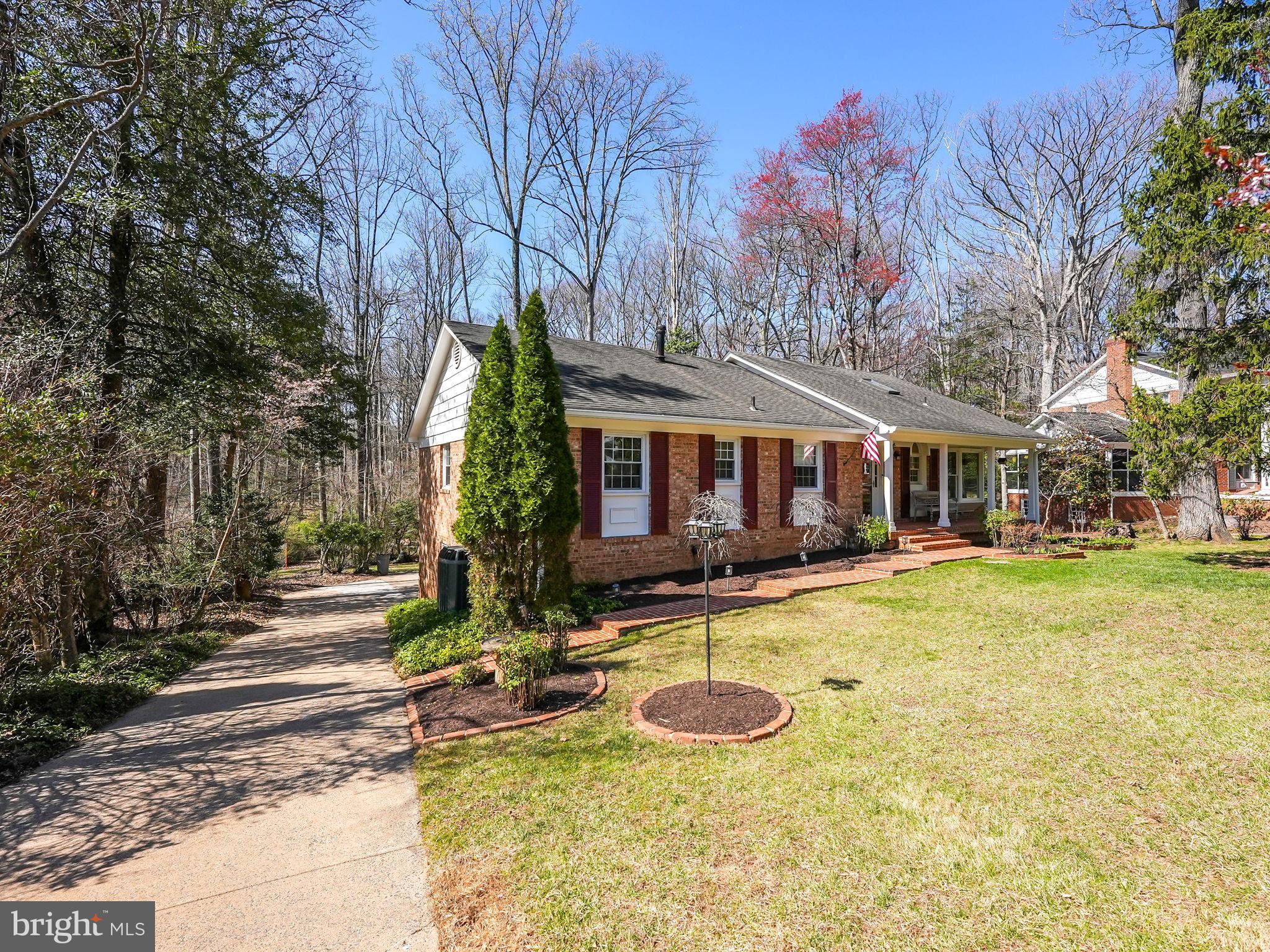 a view of a house with swimming pool and sitting area