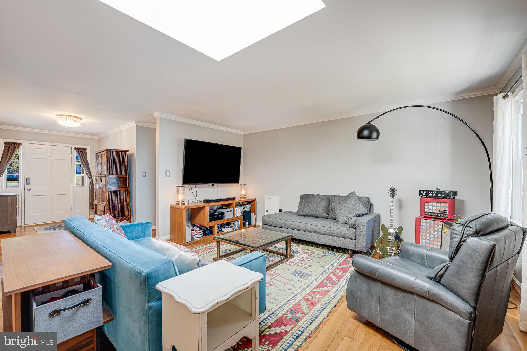 12132 Stirrup Road Reston, VA 20191 - Photo 12 of 67 a living room with furniture and a flat screen tv