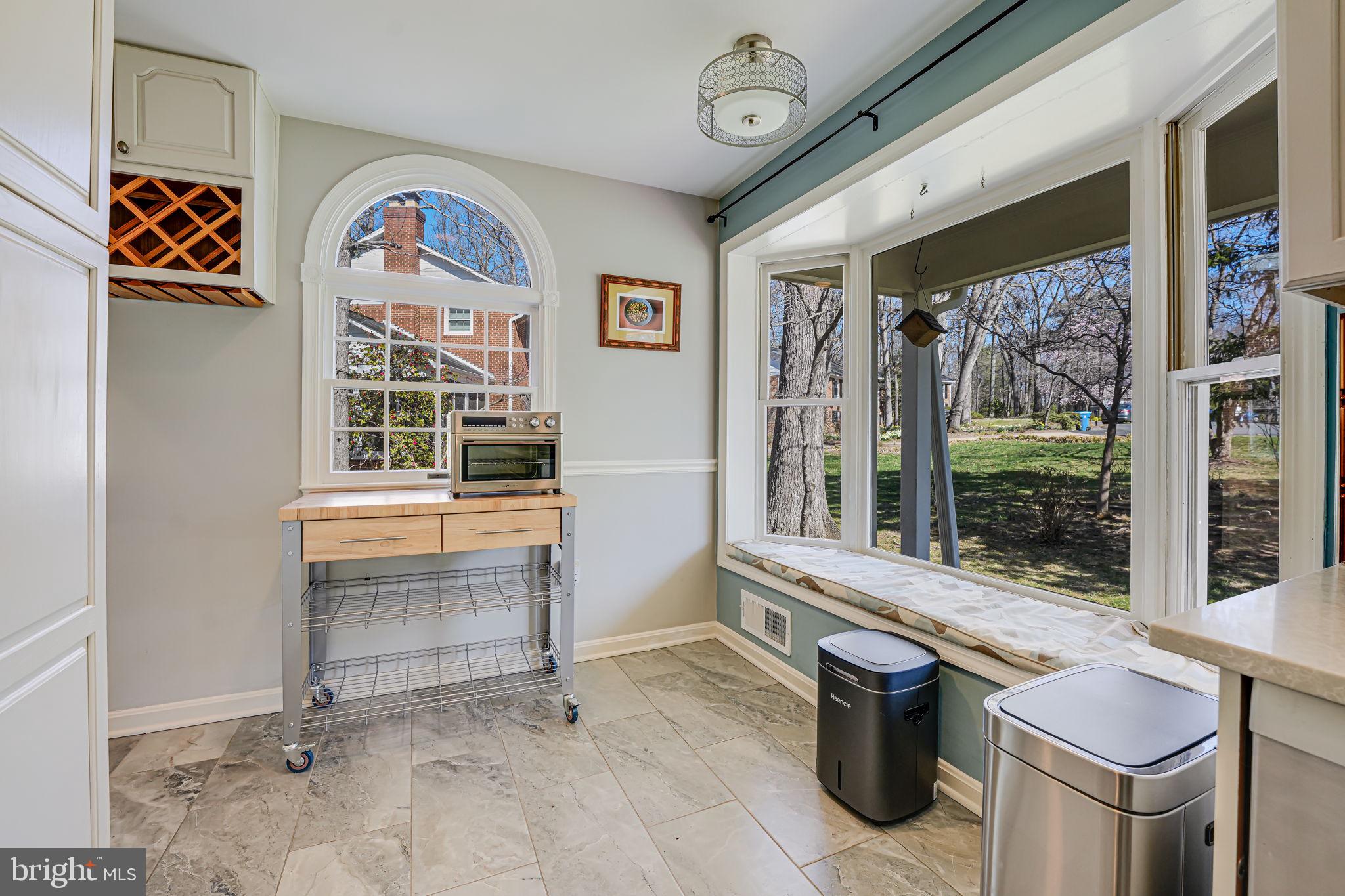 12132 Stirrup Road Reston, VA 20191 - Photo 19 of 67 a view of a hallway with a stove and a large window