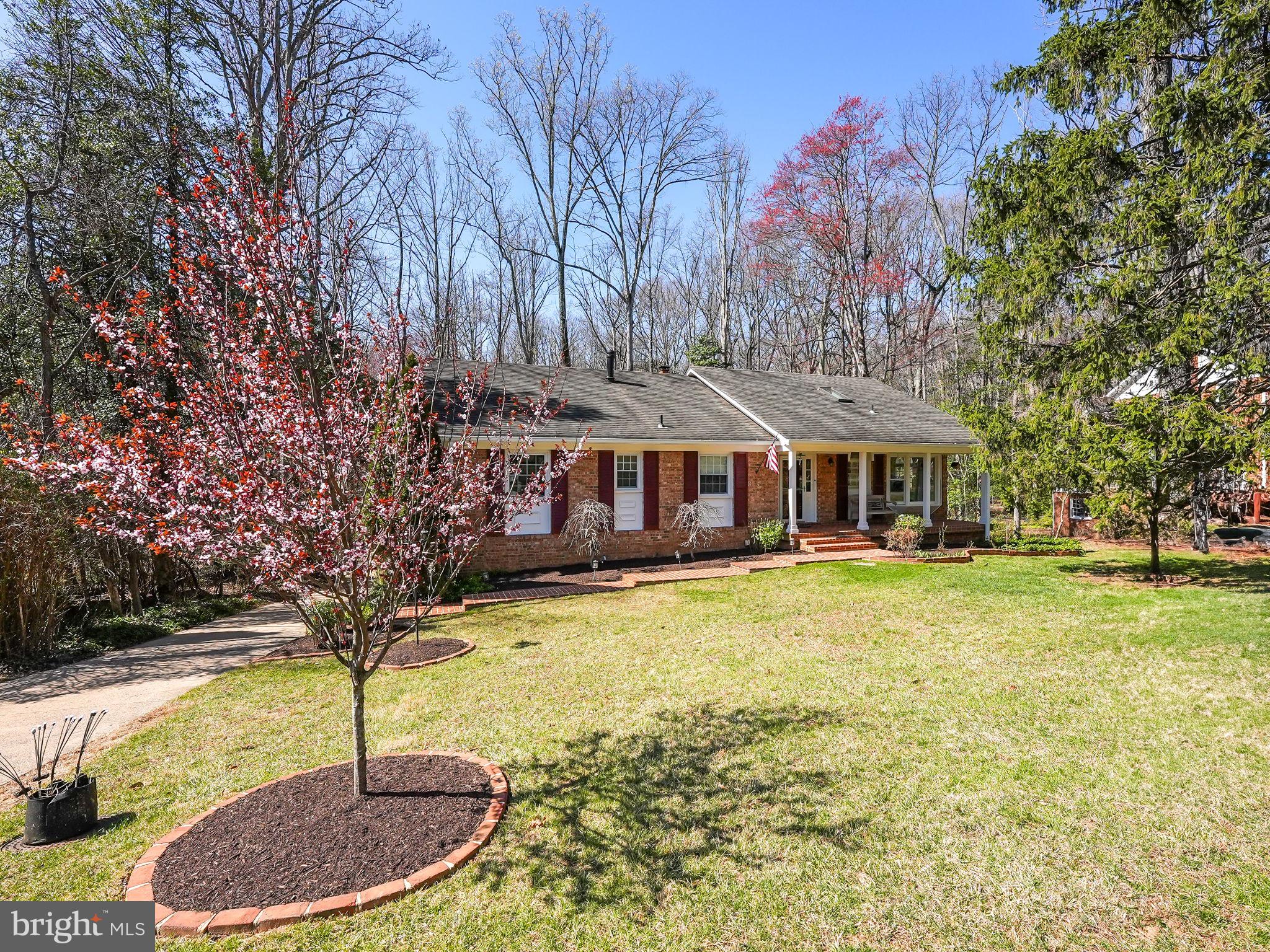 12132 Stirrup Road Reston, VA 20191 - Photo 2 of 67 a front view of a house with swimming pool