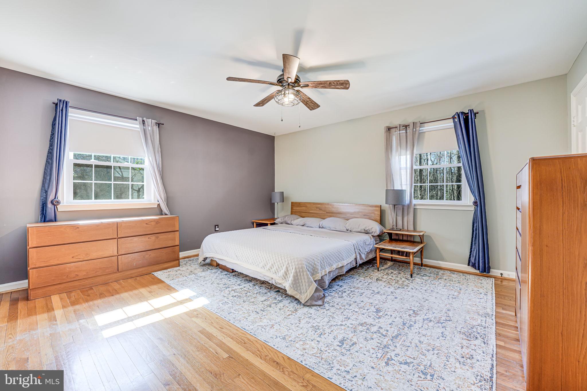 12132 Stirrup Road Reston, VA 20191 - Photo 22 of 67 a bedroom with a bed dresser and a window