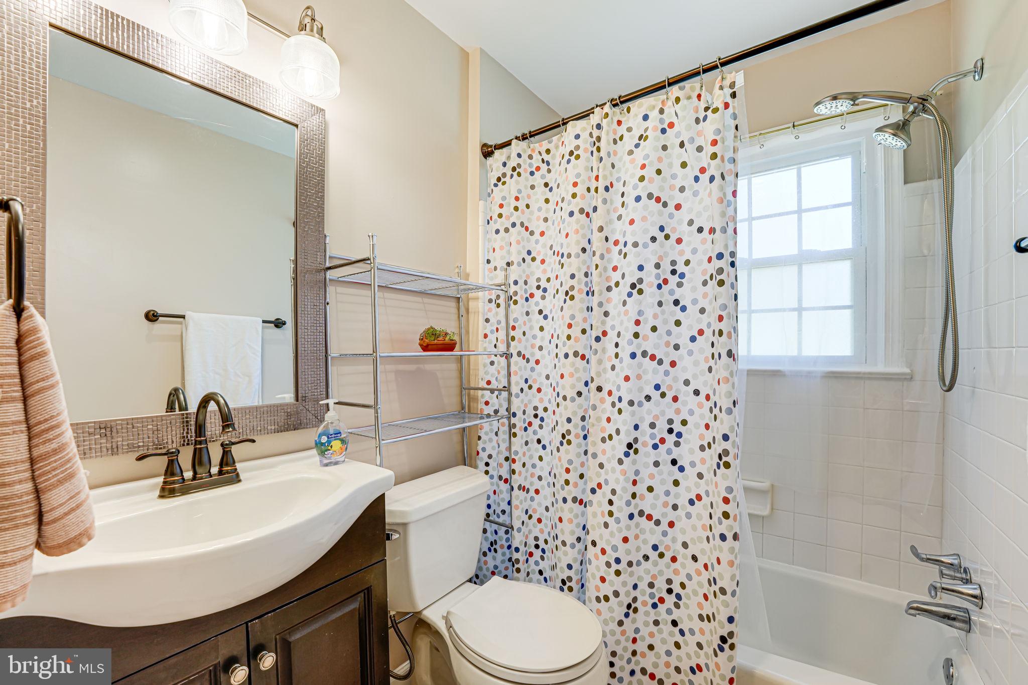 12132 Stirrup Road Reston, VA 20191 - Photo 29 of 67 a bathroom with a sink toilet and shower