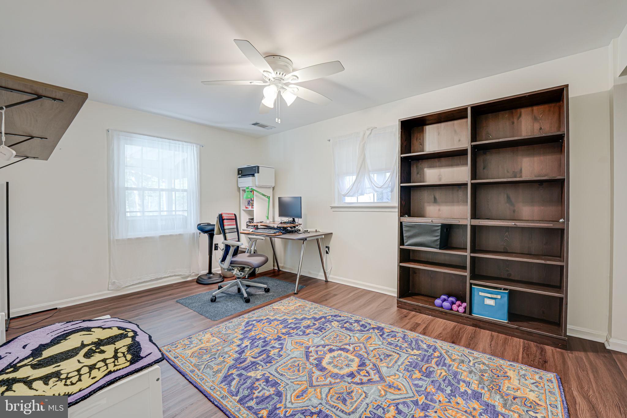 12132 Stirrup Road Reston, VA 20191 - Photo 35 of 67 a view of a workspace with furniture and a window