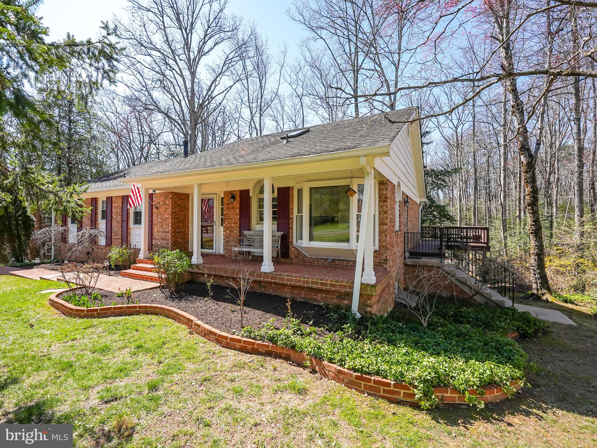 12132 Stirrup Road Reston, VA 20191 - Photo 4 of 67 a view of a house with backyard porch and sitting area