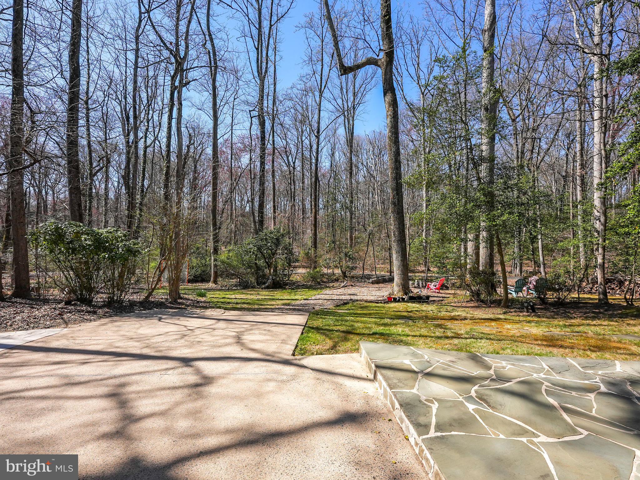 12132 Stirrup Road Reston, VA 20191 - Photo 47 of 67 a view of a swimming pool with a bench in front of it