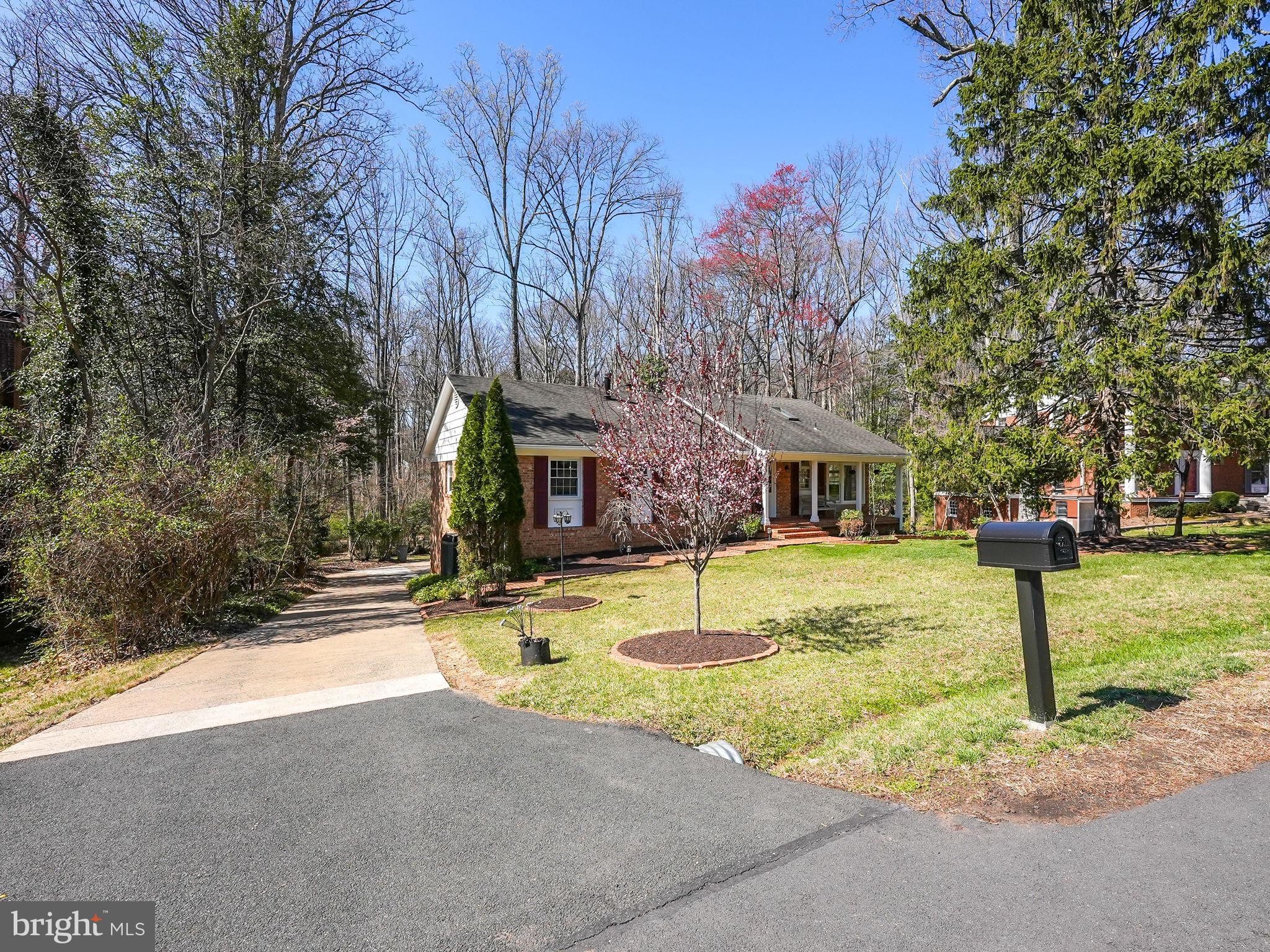 12132 Stirrup Road Reston, VA 20191 - Photo 5 of 67 a view of a house with a tree in front of it