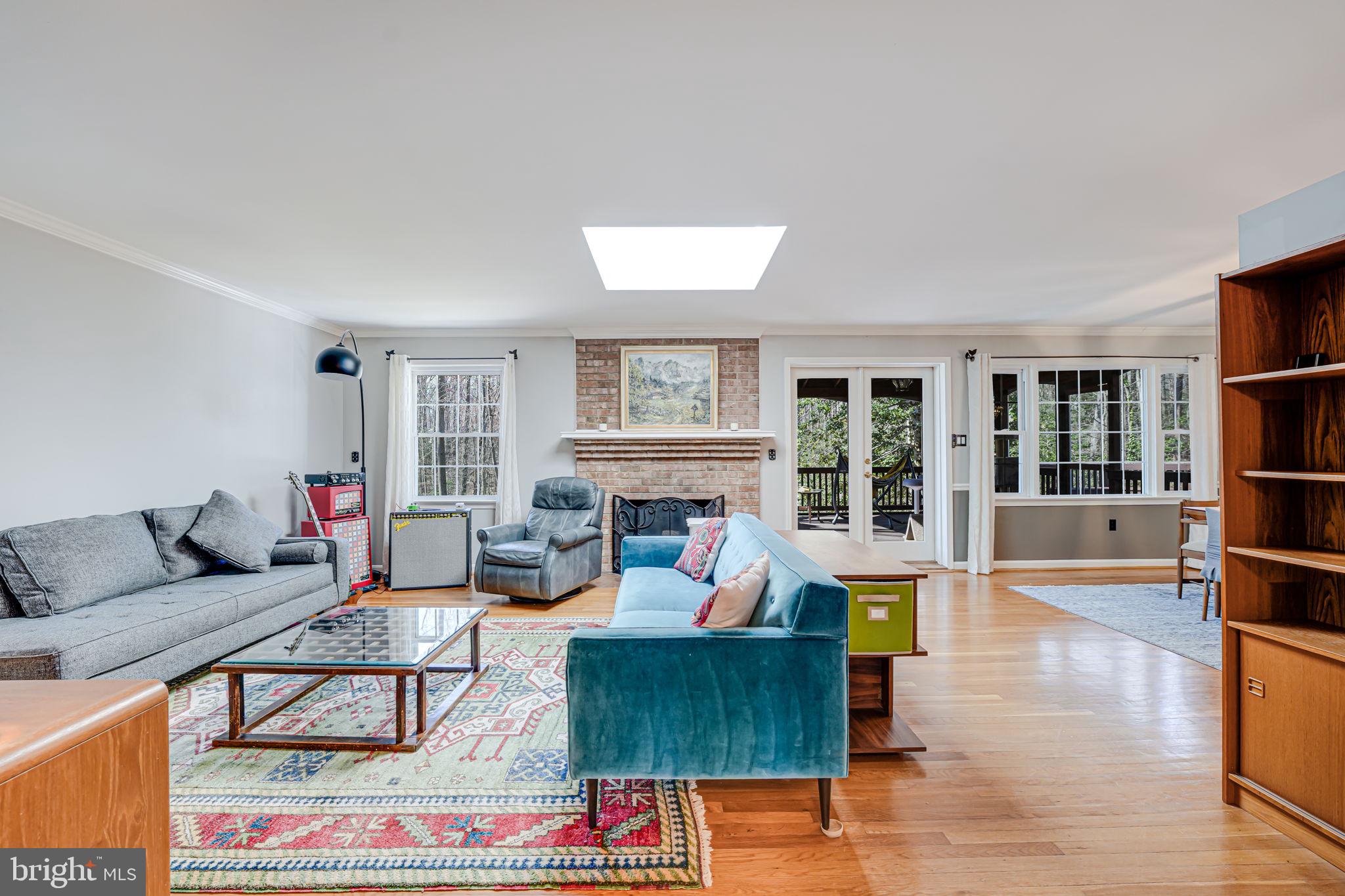 12132 Stirrup Road Reston, VA 20191 - Photo 9 of 67 a living room with furniture and a fireplace