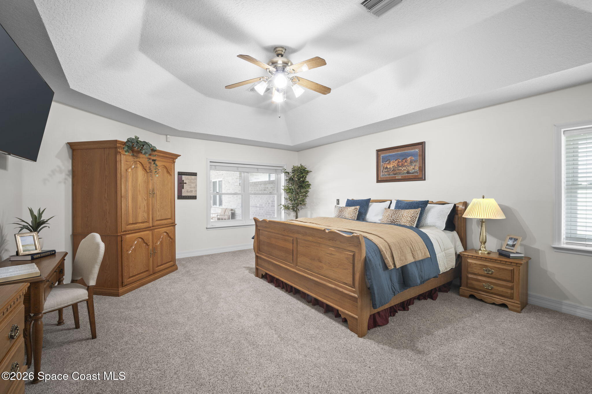3125 Davis Road Mims, FL 32754 - Photo 10 of 47 a spacious bedroom with a bed and a desk