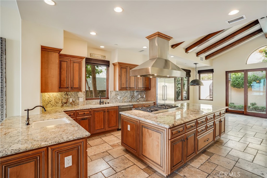 2320 Crestview Drive Laguna Beach, CA 92651 - Photo 11 of 28 a kitchen that has a lot of cabinets in it