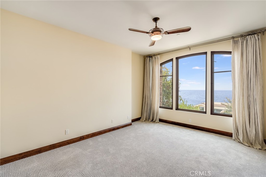 2320 Crestview Drive Laguna Beach, CA 92651 - Photo 18 of 28 a view of a livingroom with a ceiling fan and window