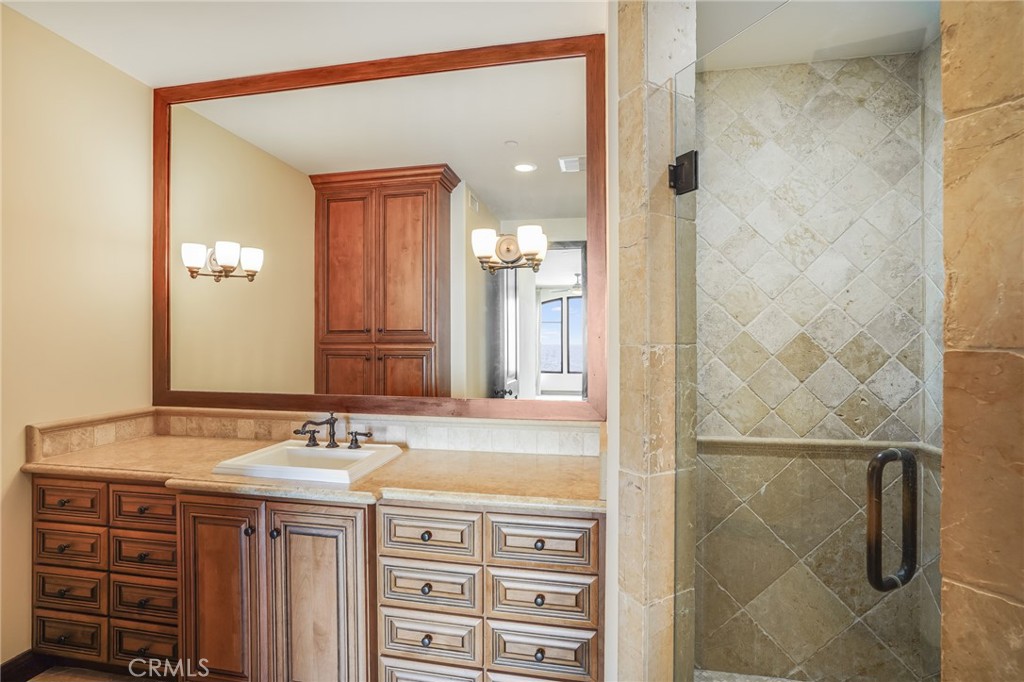 2320 Crestview Drive Laguna Beach, CA 92651 - Photo 20 of 28 a bathroom with a sink and a mirror
