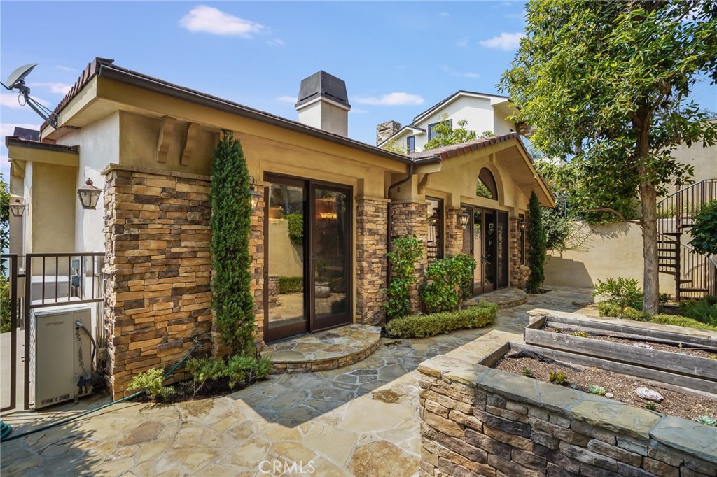 2320 Crestview Drive Laguna Beach, CA 92651 - Photo 24 of 28 a front view of a house with a garden