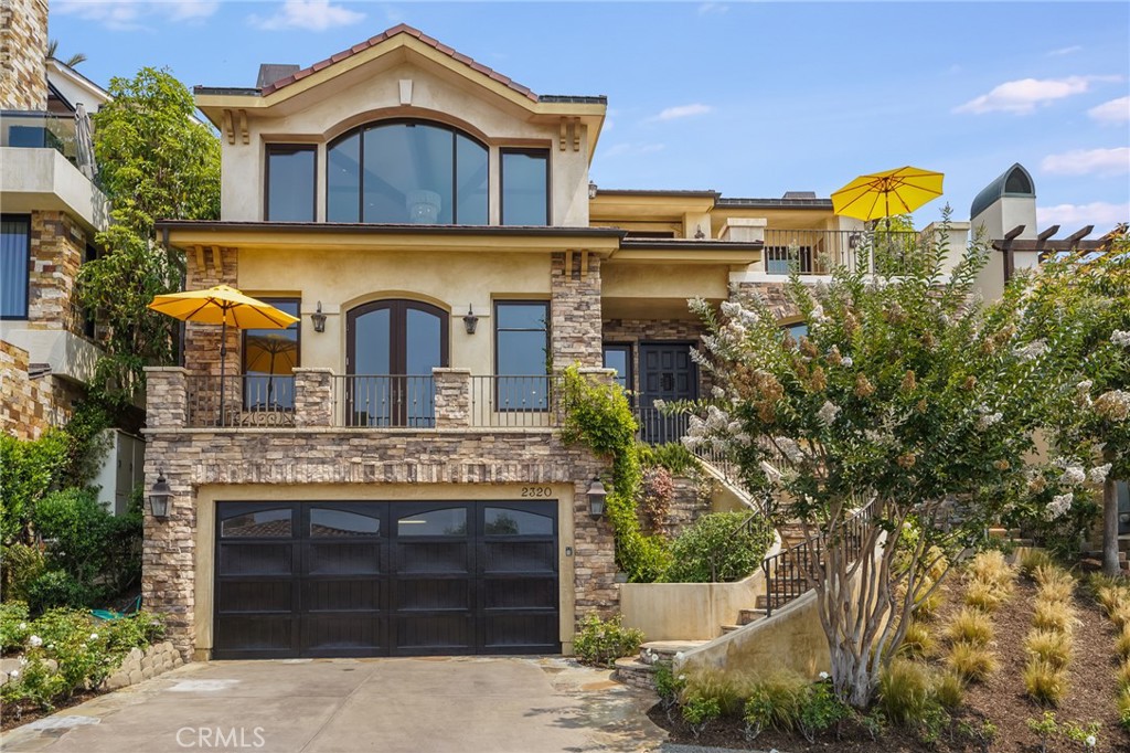 2320 Crestview Drive Laguna Beach, CA 92651 - Photo 26 of 28 a front view of a house with a yard
