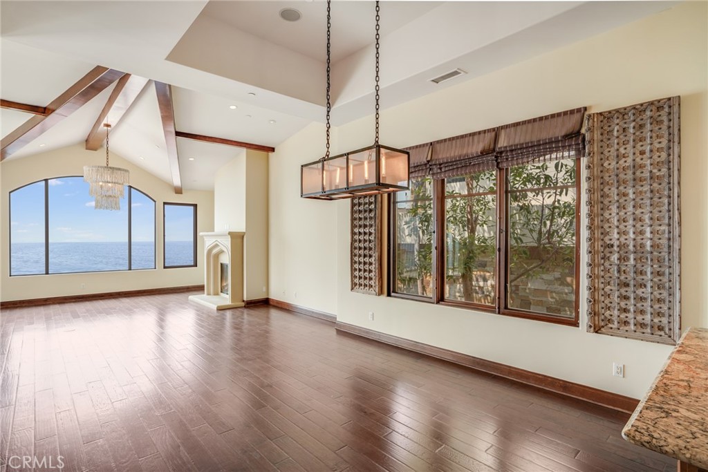 2320 Crestview Drive Laguna Beach, CA 92651 - Photo 7 of 28 a view of an empty room with wooden floor and a window