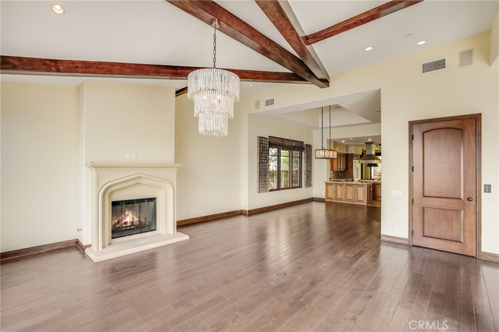 2320 Crestview Drive Laguna Beach, CA 92651 - Photo 8 of 28 a view of a livingroom with wooden floor a fireplace and window