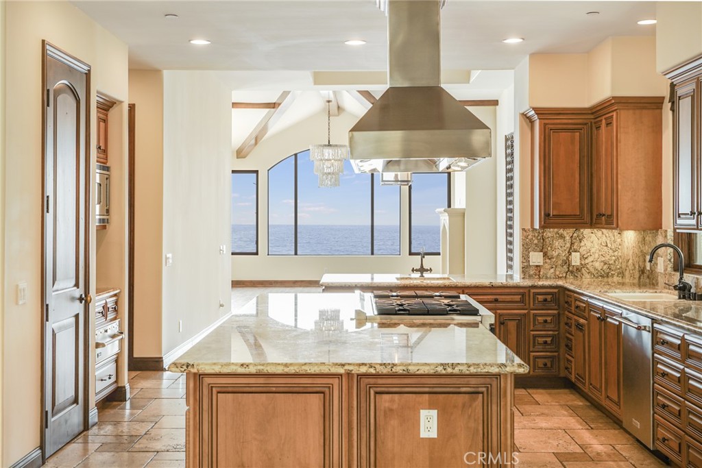 2320 Crestview Drive Laguna Beach, CA 92651 - Photo 9 of 28 a kitchen with a sink stove and cabinets