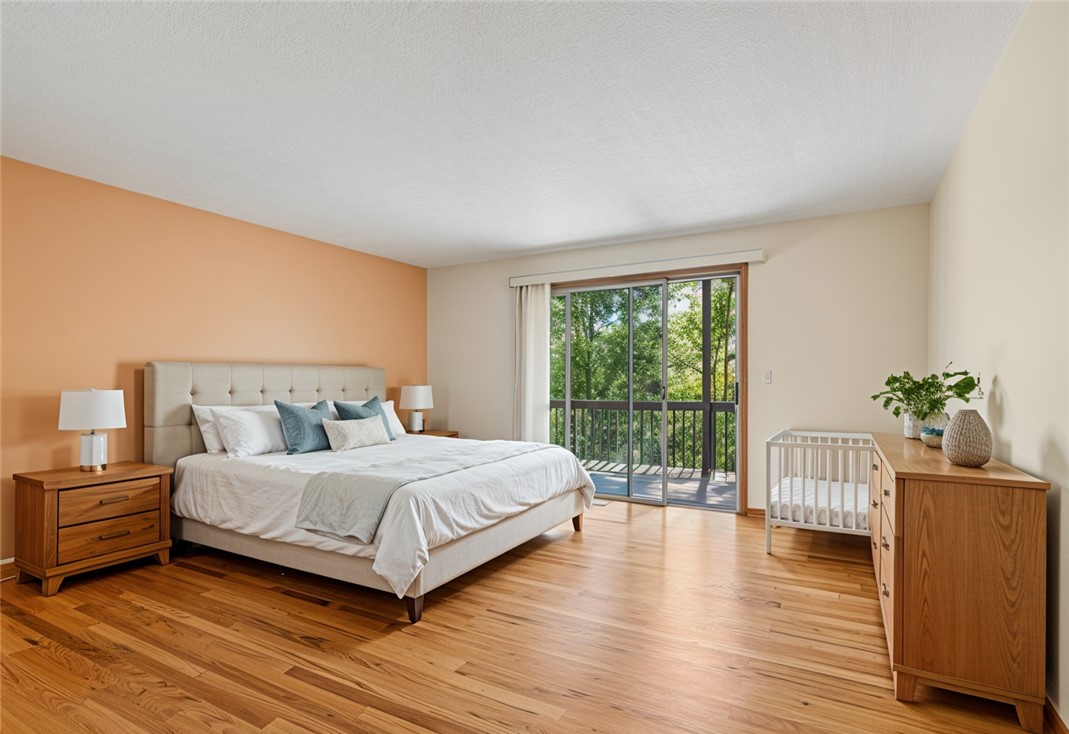 213 Shipmaster Drive Salem, SC 29676 - Photo 18 of 33 This spacious room features rich wood flooring and a private balcony, offering serene outdoor access.