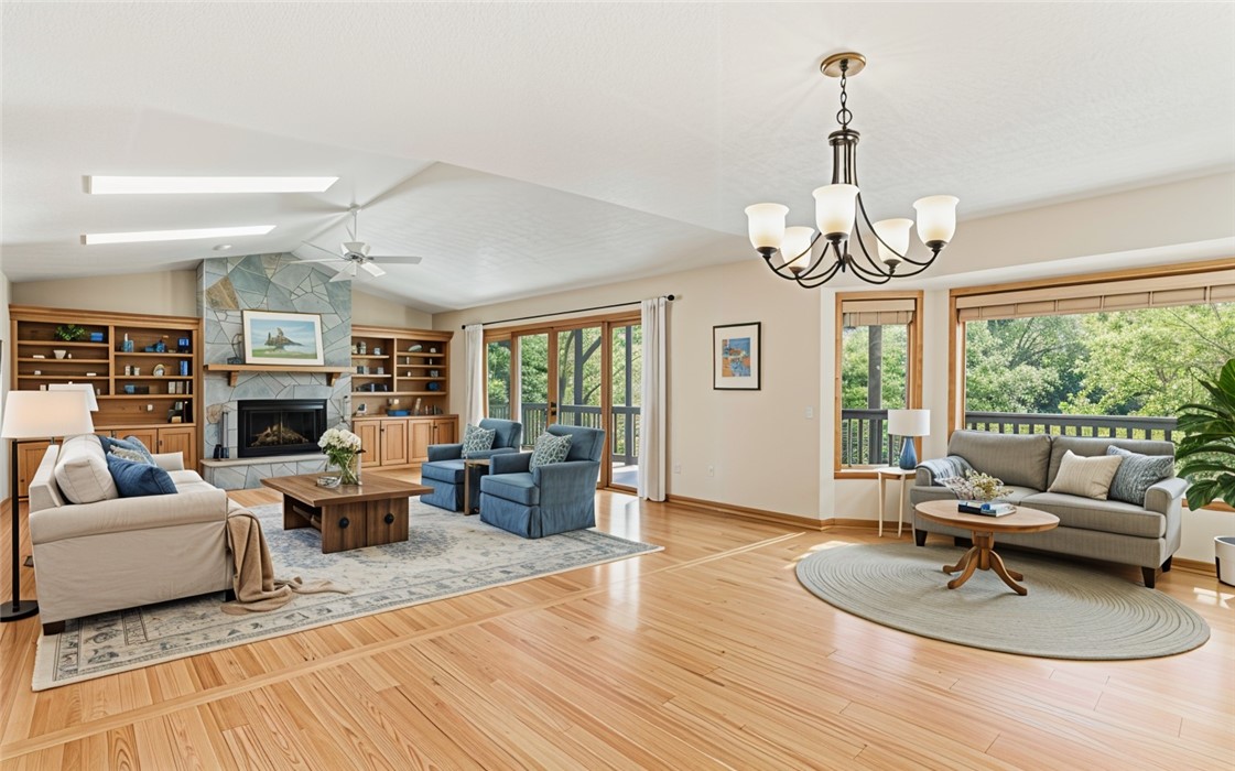 213 Shipmaster Drive Salem, SC 29676 - Photo 3 of 33 This inviting living area features a stone fireplace, built-in shelving, and direct outdoor access. Virtually staged