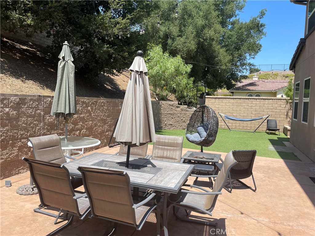 1563 Silver Shadow Drive Thousand Oaks, CA 91320 - Photo 4 of 24 a view of a dinning table and chairs in the patio