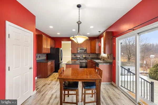 a view of a dining room with furniture window and wooden floor