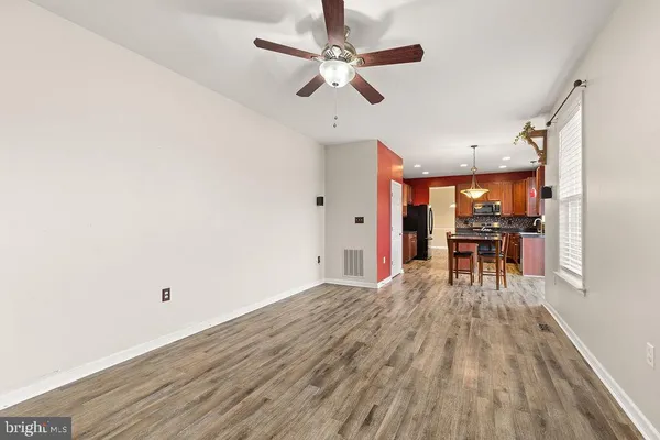 a view of a workspace with wooden floor