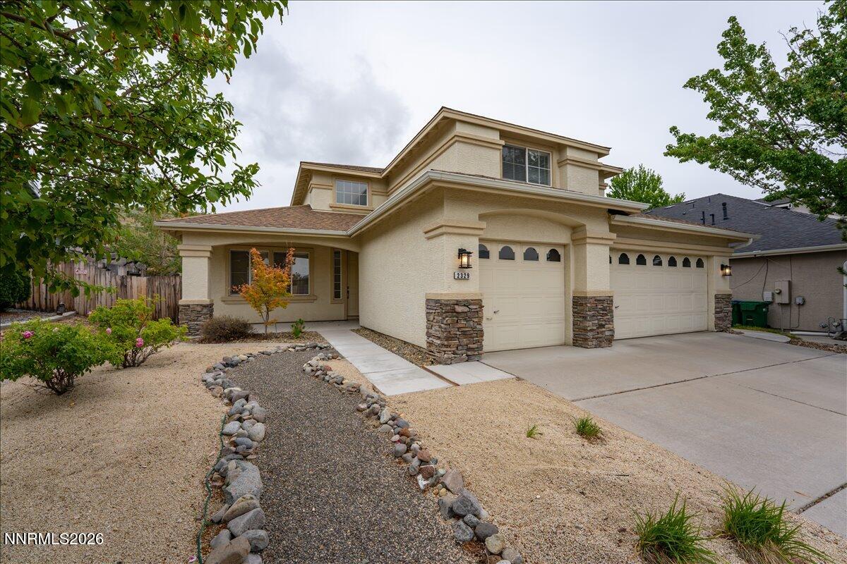2329 Red Maple Court Reno, NV 89523 - Photo 3 of 39 a front view of a house with a yard