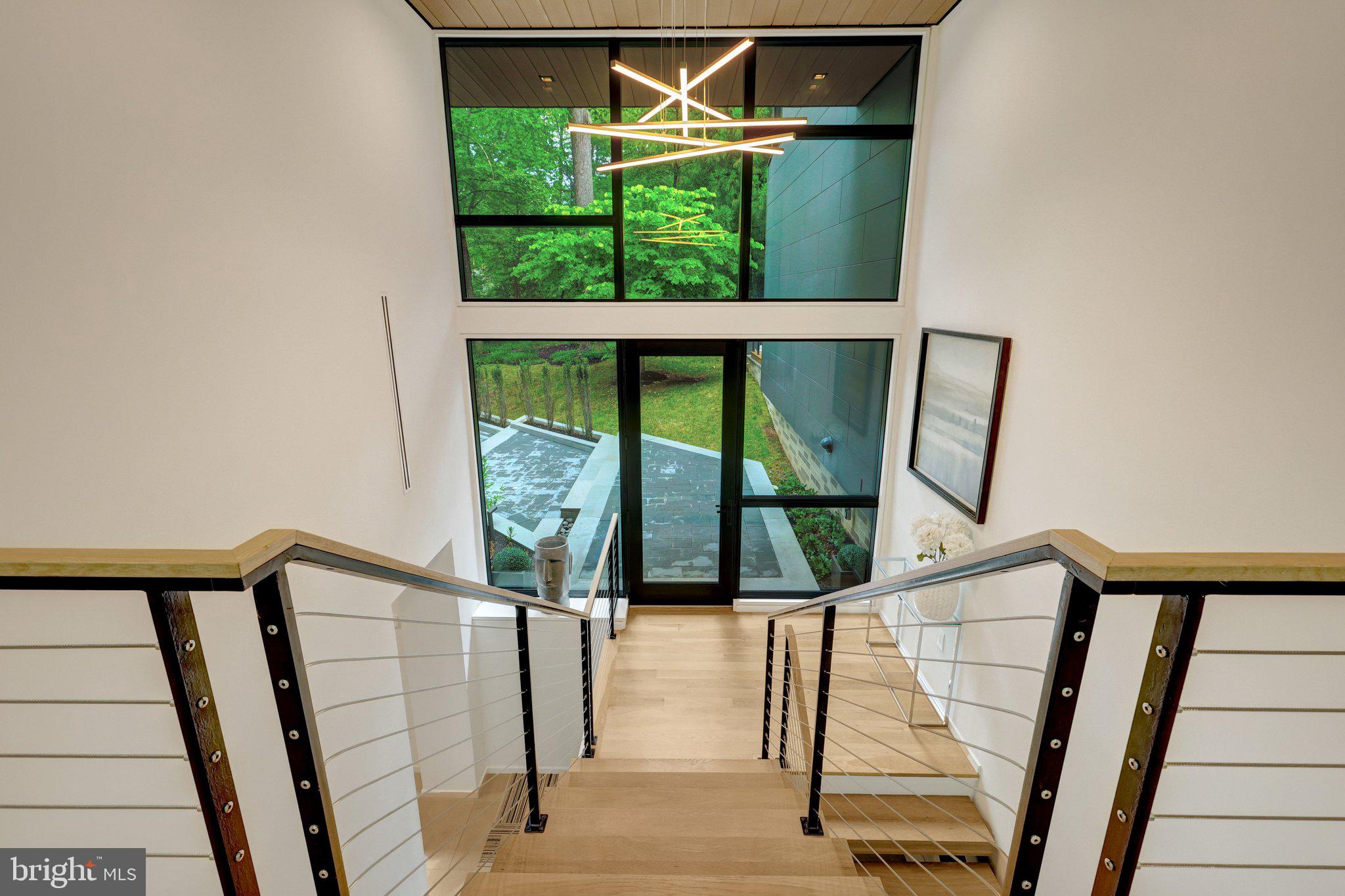 7815 Old Falls Road McLean, VA 22102 - Photo 26 of 85 Floating white oak staircase and 2-story foyer
