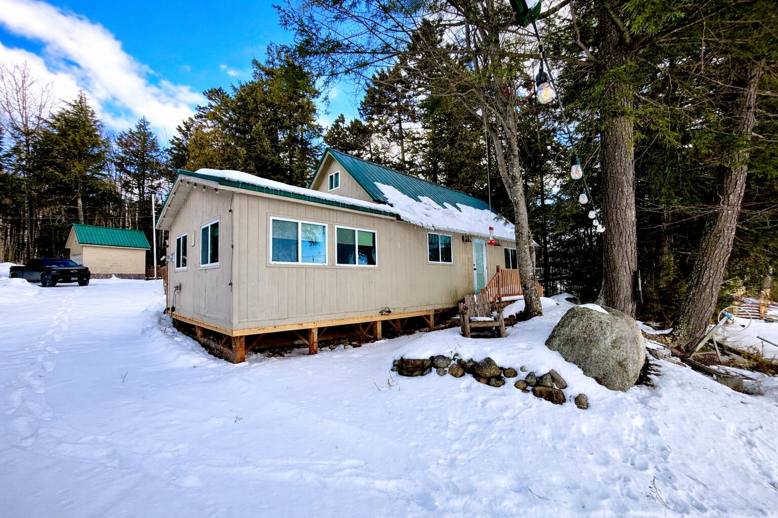 380 Cedar Lake Road Millinocket, ME 04462 - Photo 4 of 30 Snowy cabin in the forest
