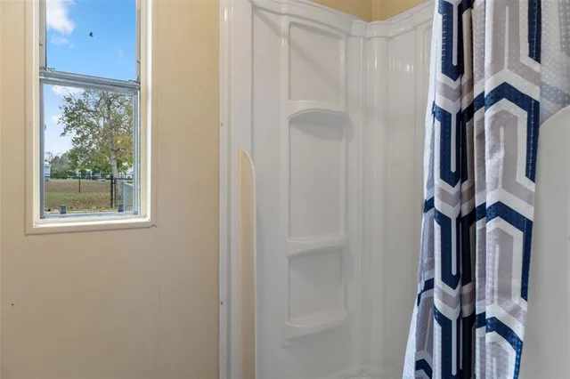 a view of an entryway with a mirror