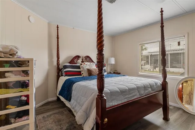 a bedroom with bed and a window