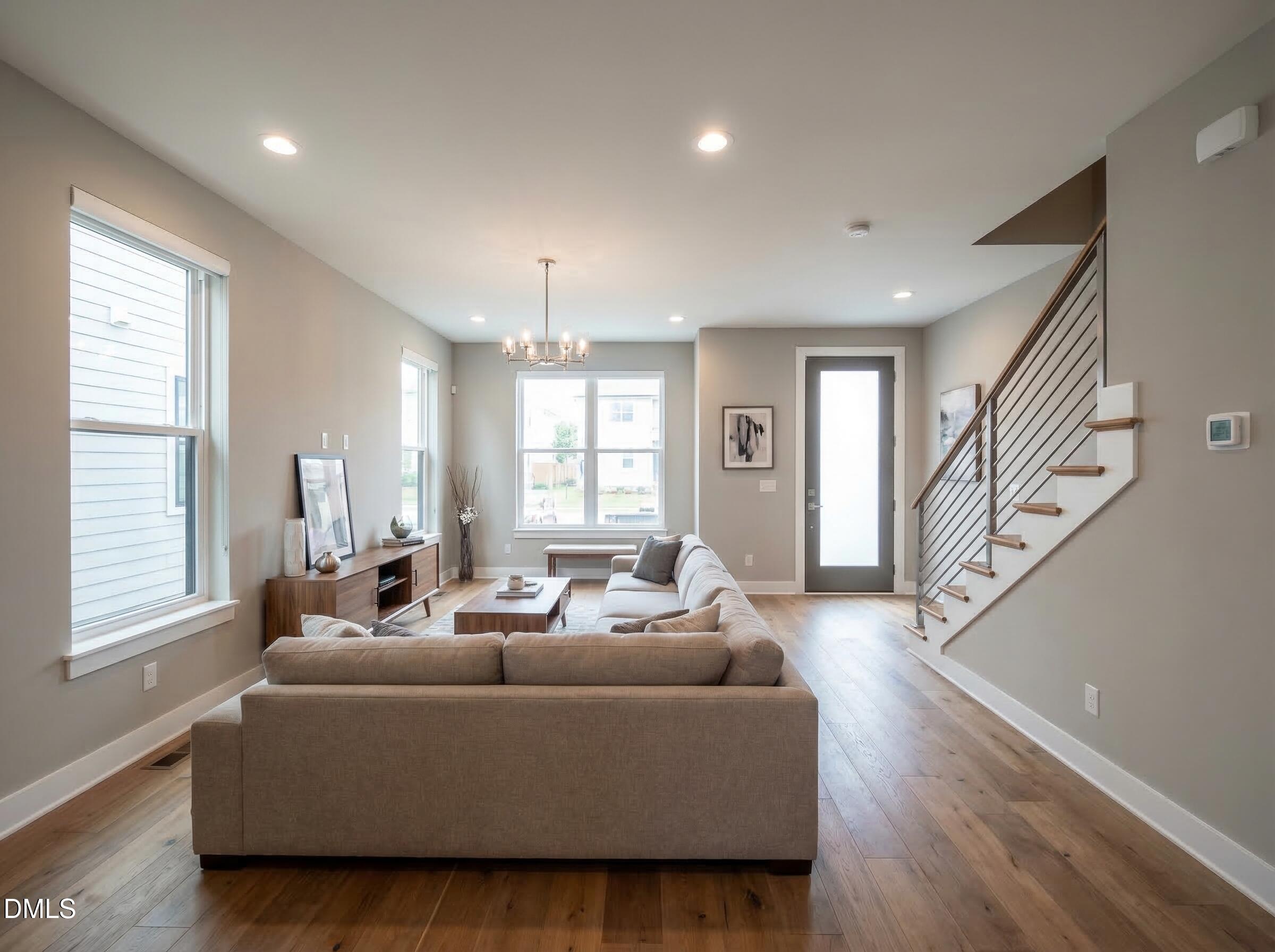 1222 Merrick Street Durham, NC 27707 - Photo 4 of 13 a living room with furniture wooden floor and a large window