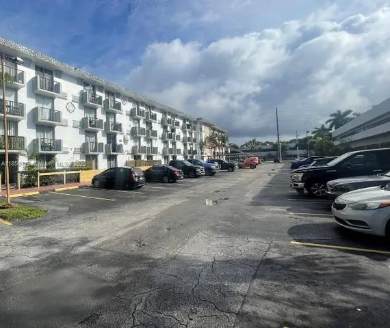 a view of street with parked cars