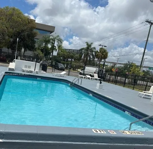 a view of a swimming pool with a patio