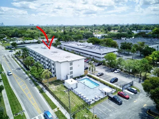 an aerial view of a house with outdoor space