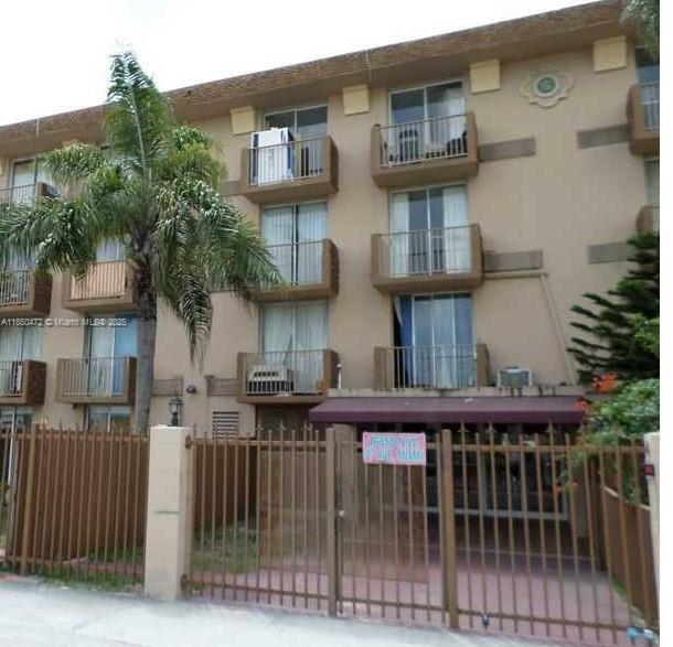 16450 Northwest 2nd Avenue, Unit 218 Miami, FL 33169 - Photo 5 of 16 a view of a brick house with many windows