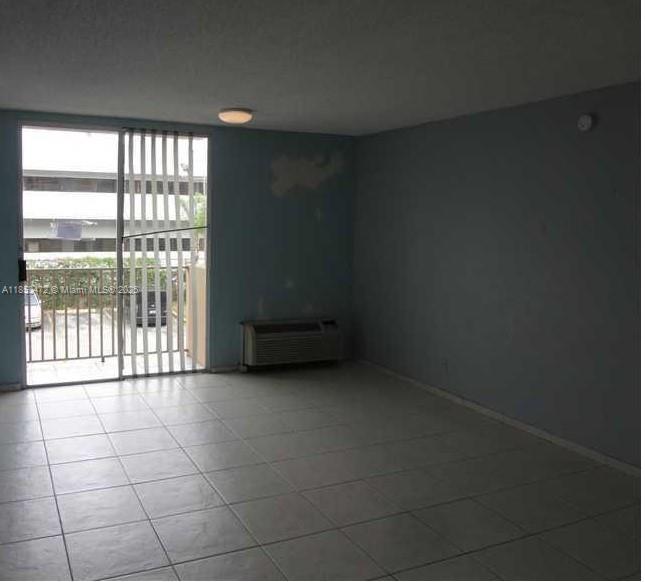 16450 Northwest 2nd Avenue, Unit 218 Miami, FL 33169 - Photo 6 of 16 a view of an empty room with a window